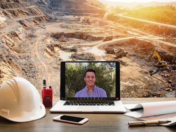 a laptop in front of a mining site