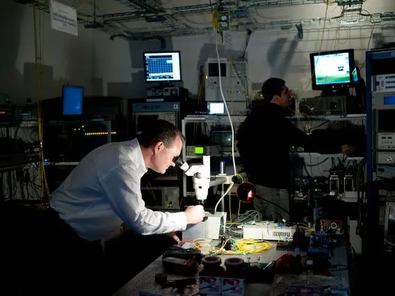 man looking into a microscope