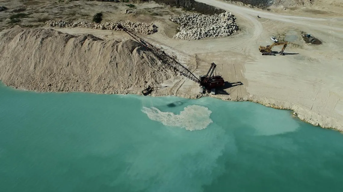 Description- A small dragline mines limestone at a small industrial-minerals mine in central Florida.