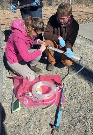 PhD students Becca Tyne and Chandler Noyes collecting noble gas samples to date groundwaters in Paradox Valley