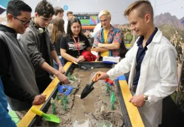 Undergraduate Alejandro Durazo at the Environmental Reclamation station