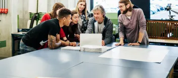 students gathered around a computer